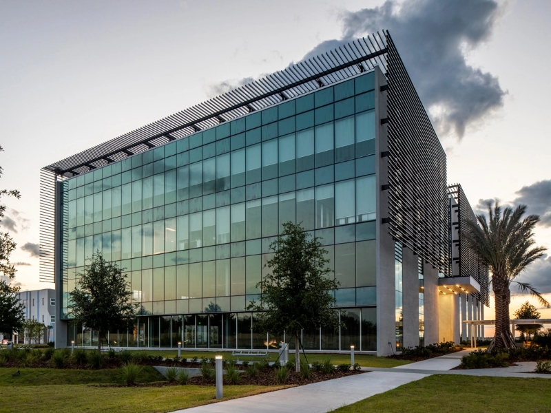 OSA6R bollards light the pathway to a modern office building.